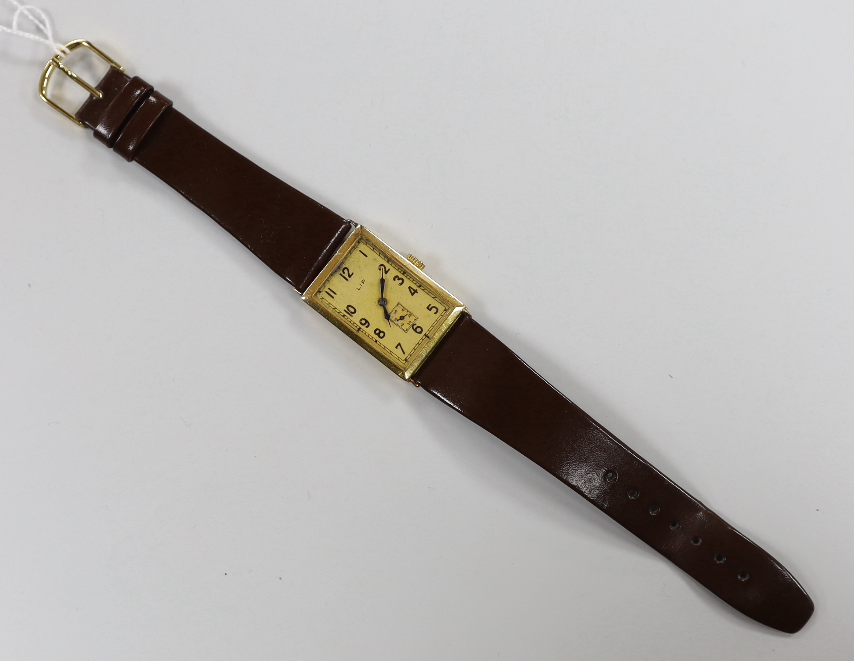 A French yellow metal (18ct poincon mark) LIP T18 'Churchill' manual wind rectangular Arabic dial wrist watch, with subsidiary seconds, on a later strap.